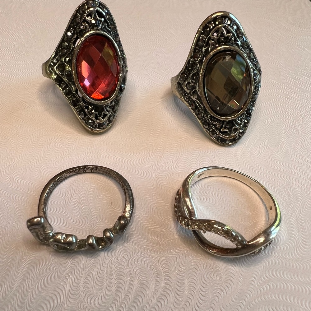 Set of 4 rings with some cool designs on them